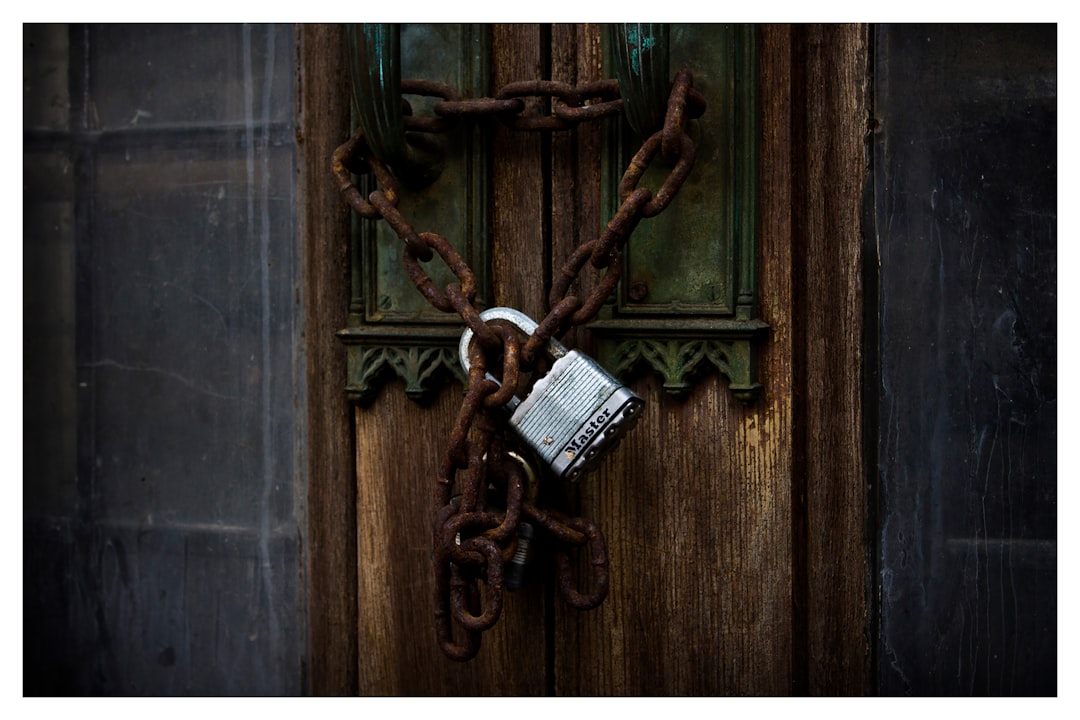 gray metal padlock, "Locked Secrets"
