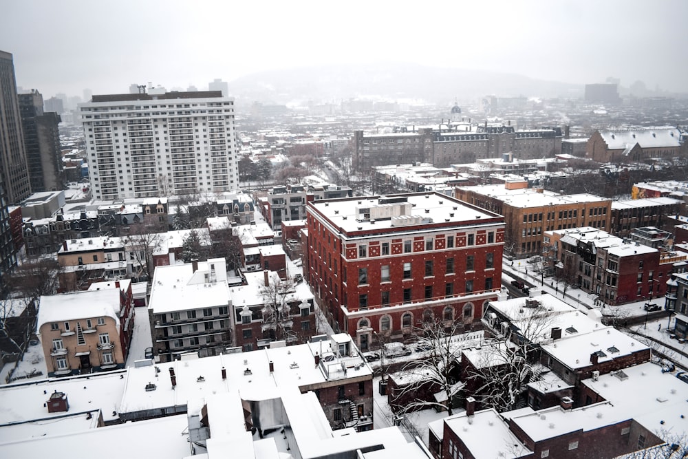 aerial photogprahy of buildings covered with snow