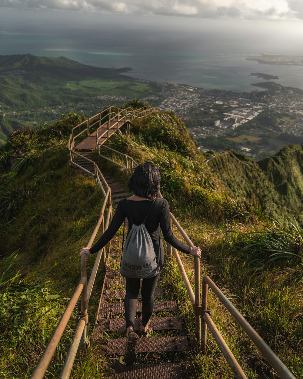 woman walking near stairway during daytime