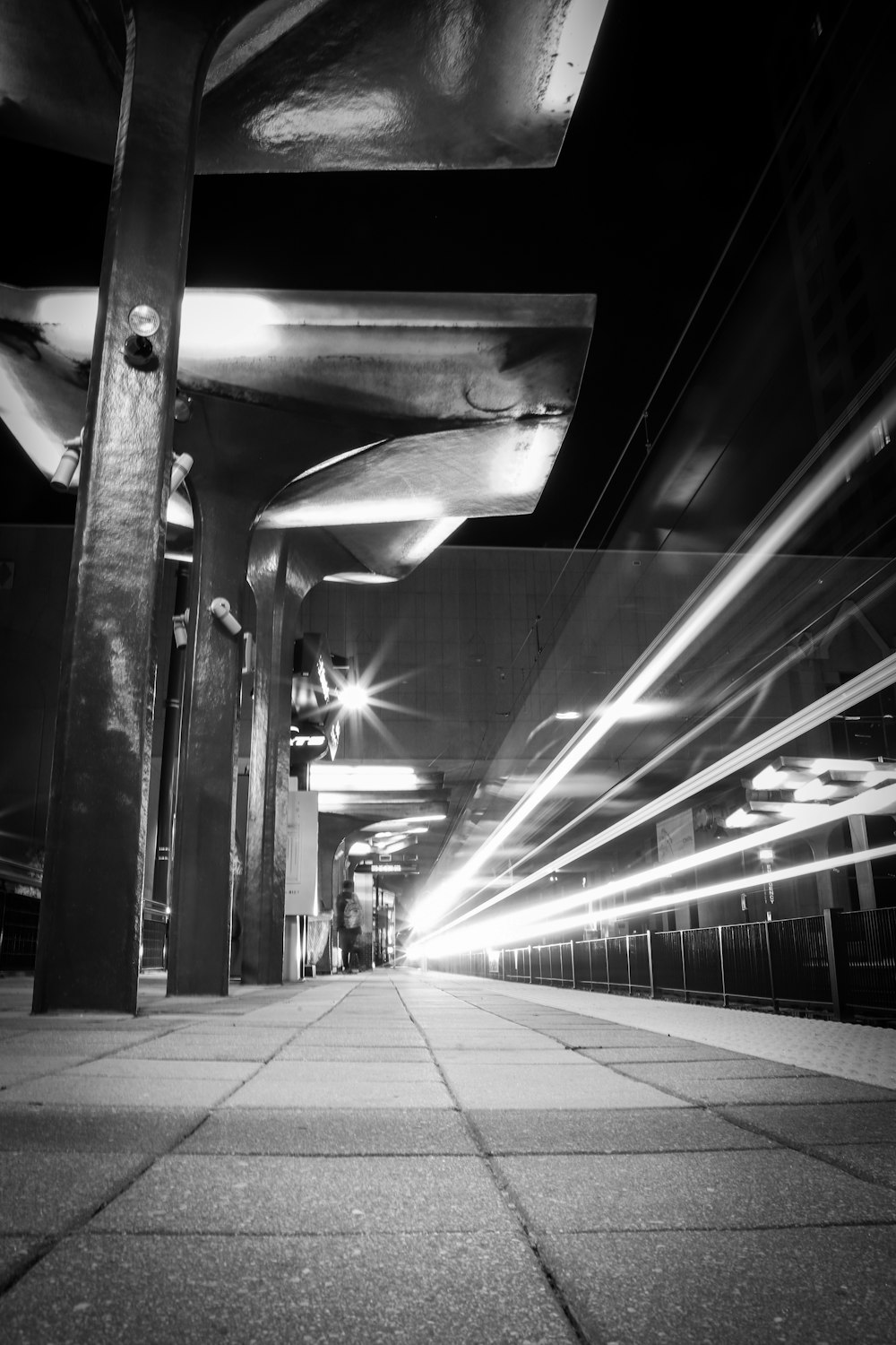 grayscale photo of underground train station