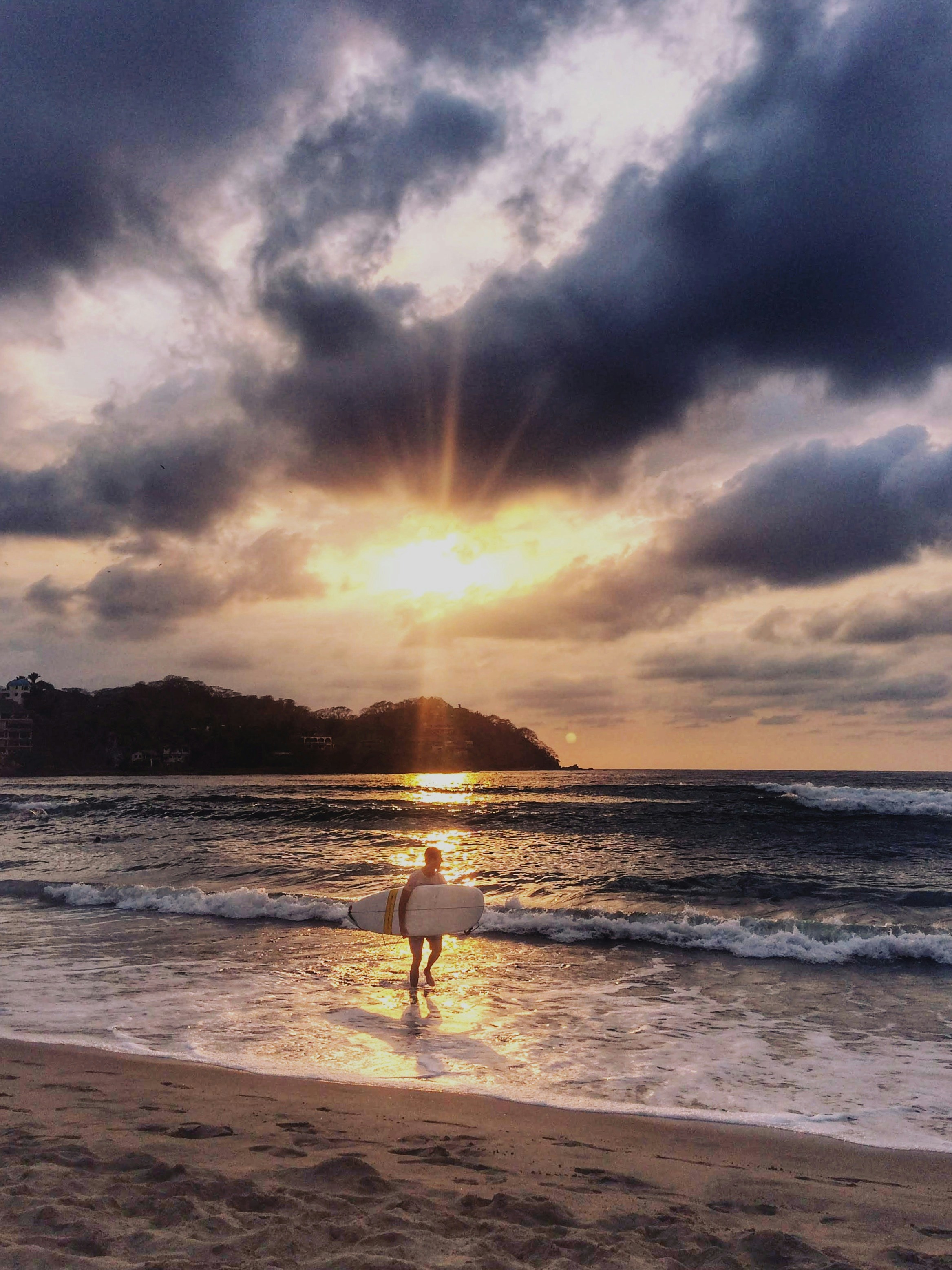 man holding surfboard