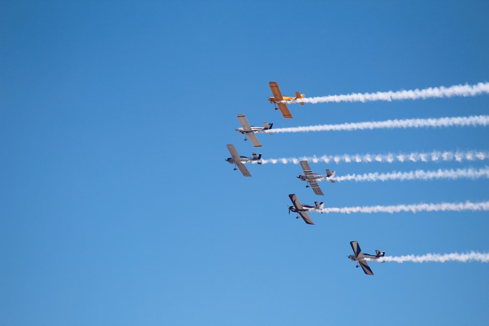 flying jet planes under blue sky