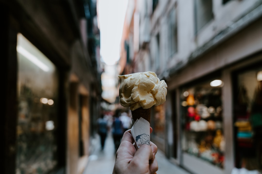 yellow ice cream on brown cone macro photography