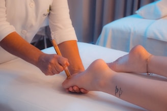 person massaging a foot