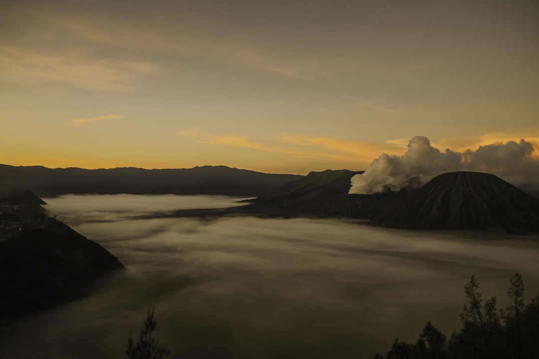 sea of clouds and mountain peak photo,