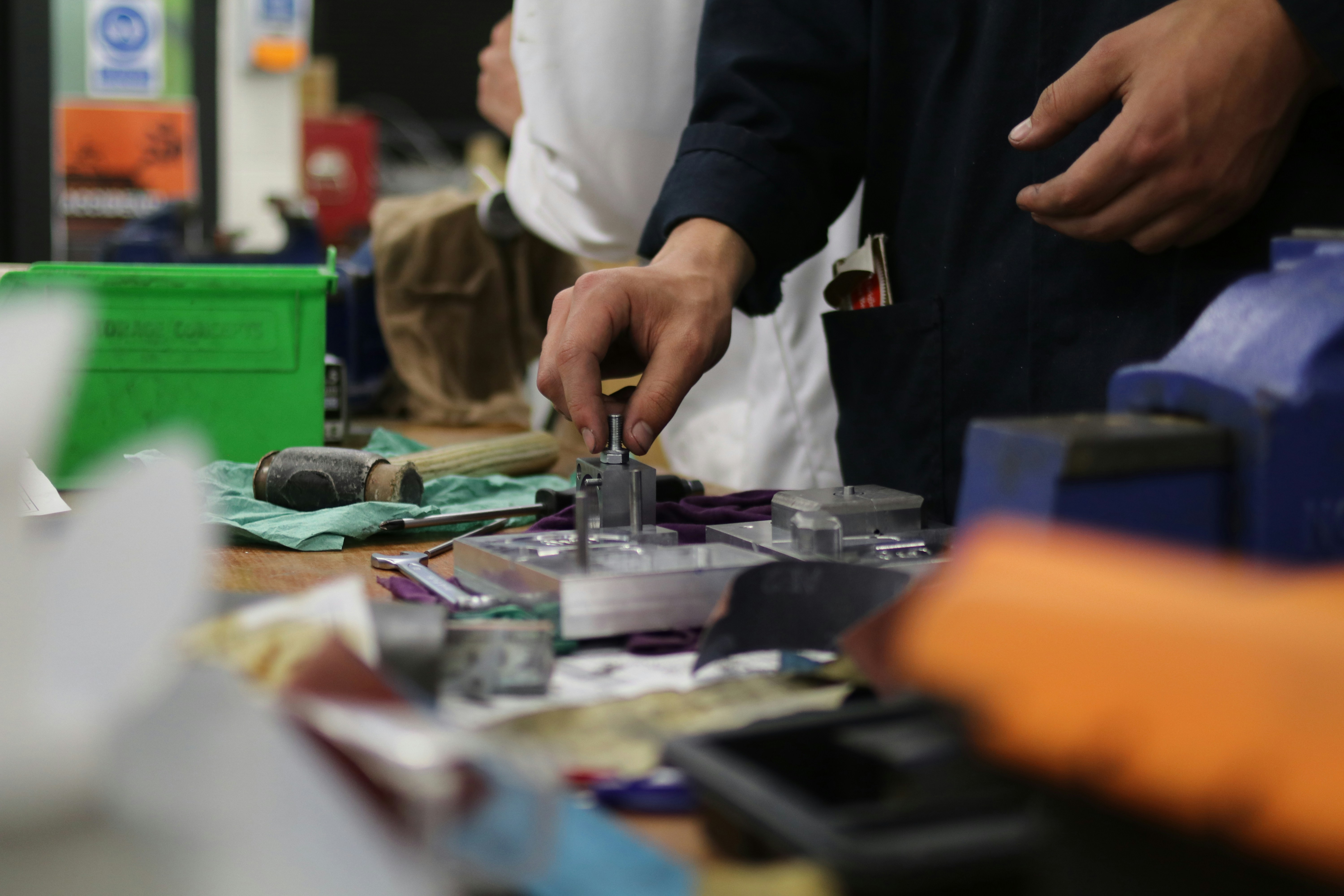 Engineer testing prototype solid-state EV battery cells in a research lab