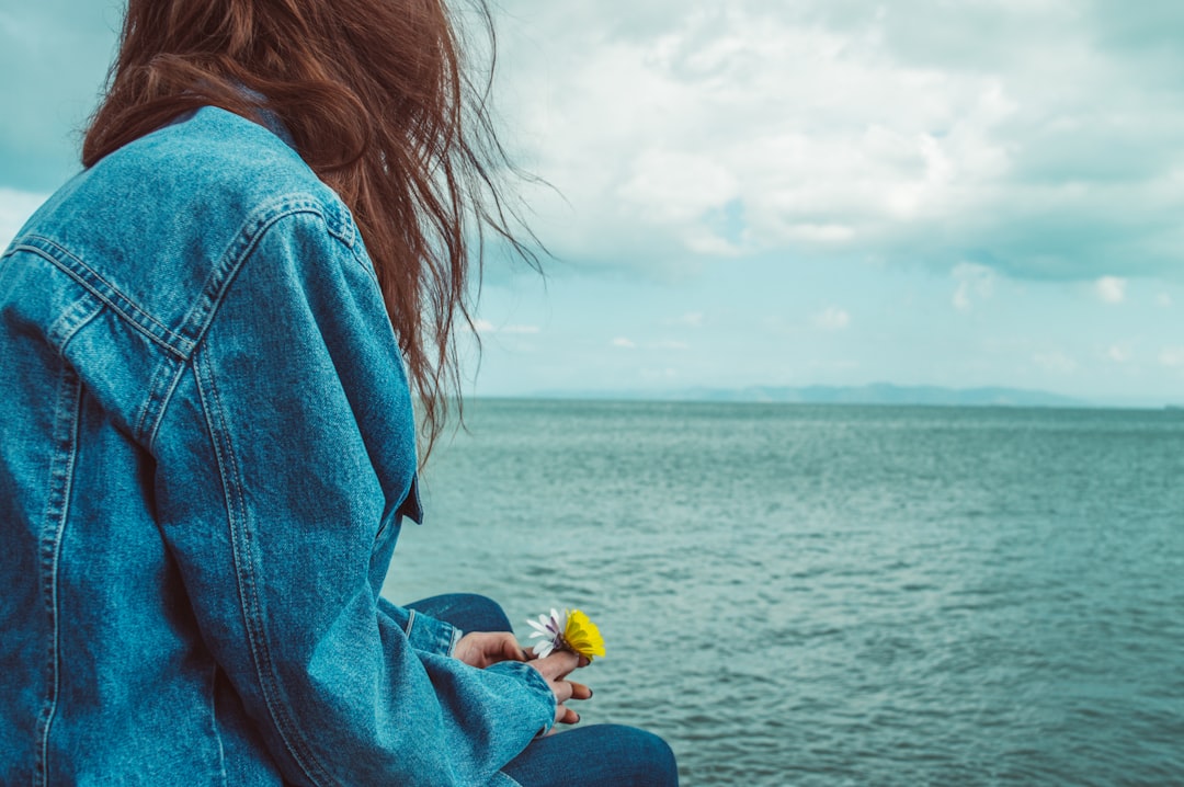 woman wearing blue denim jacket