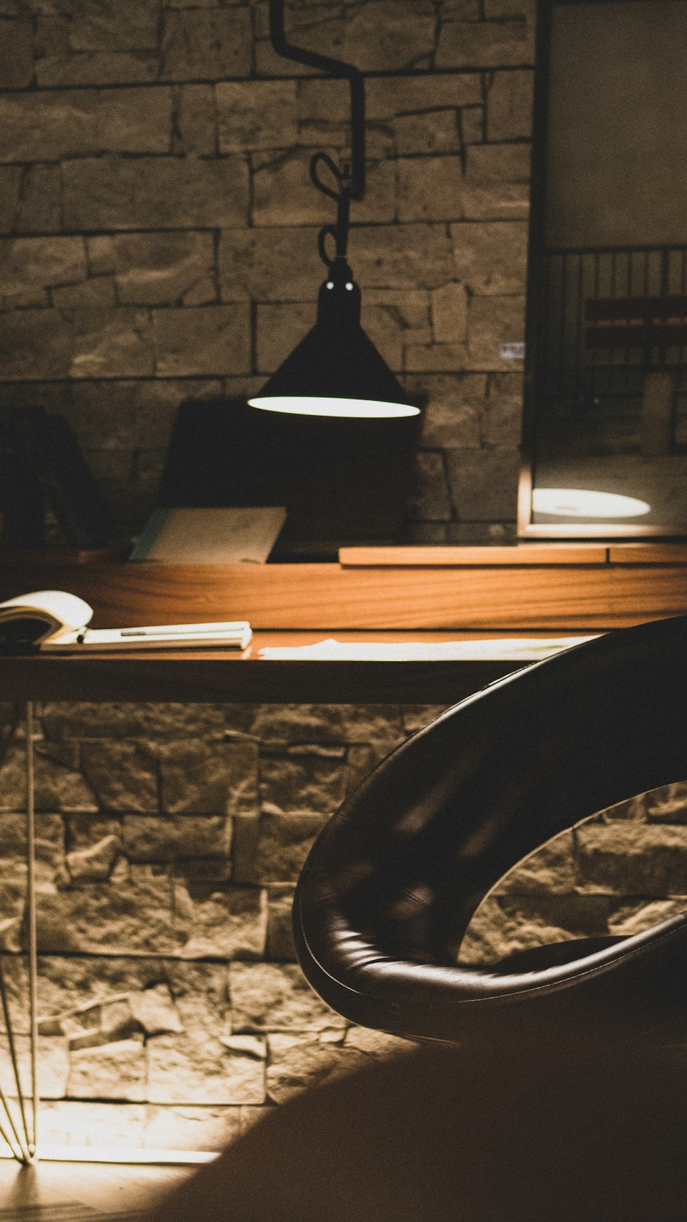 black lamp and leather chair