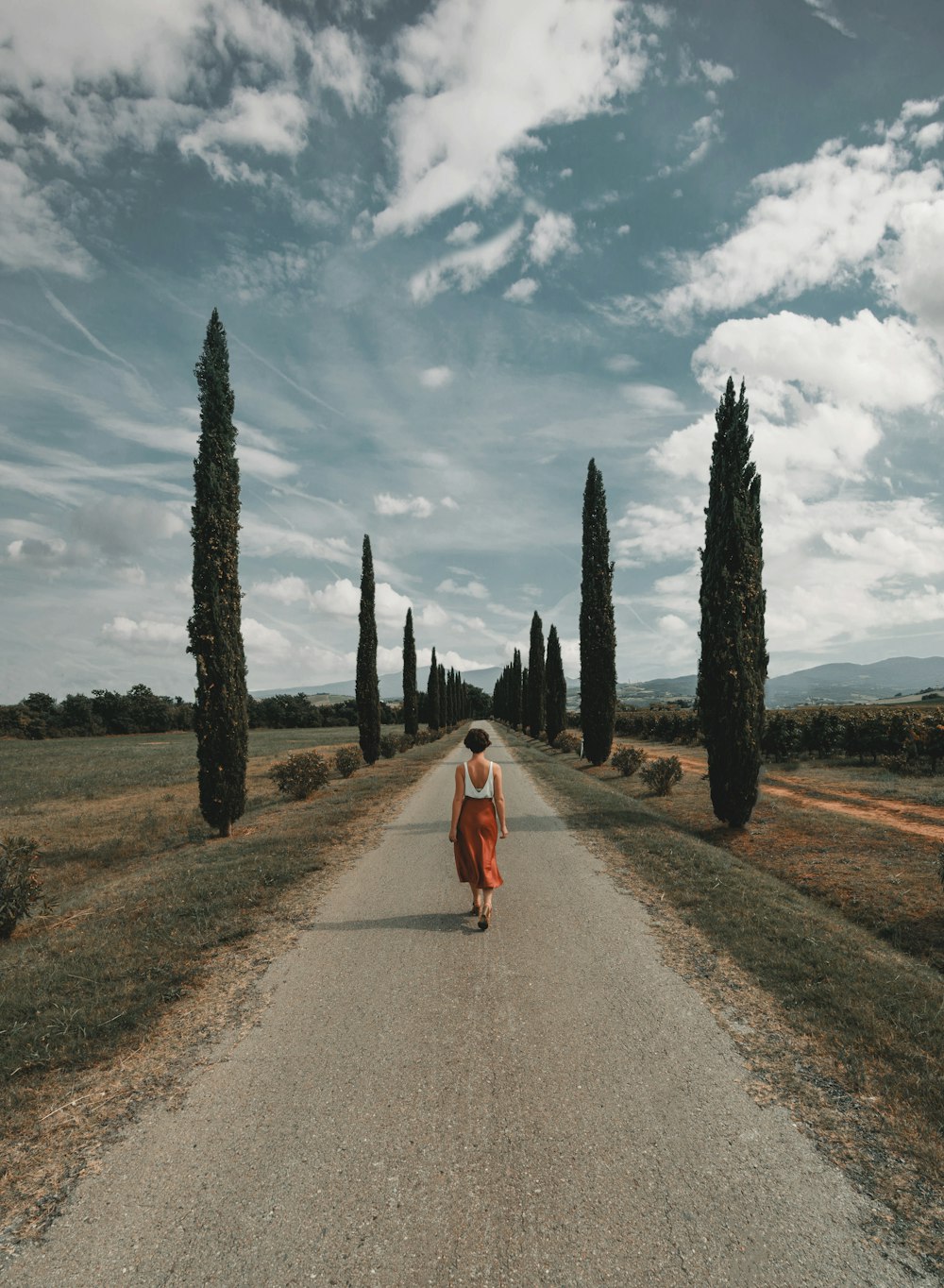 woman standing in the middle of road