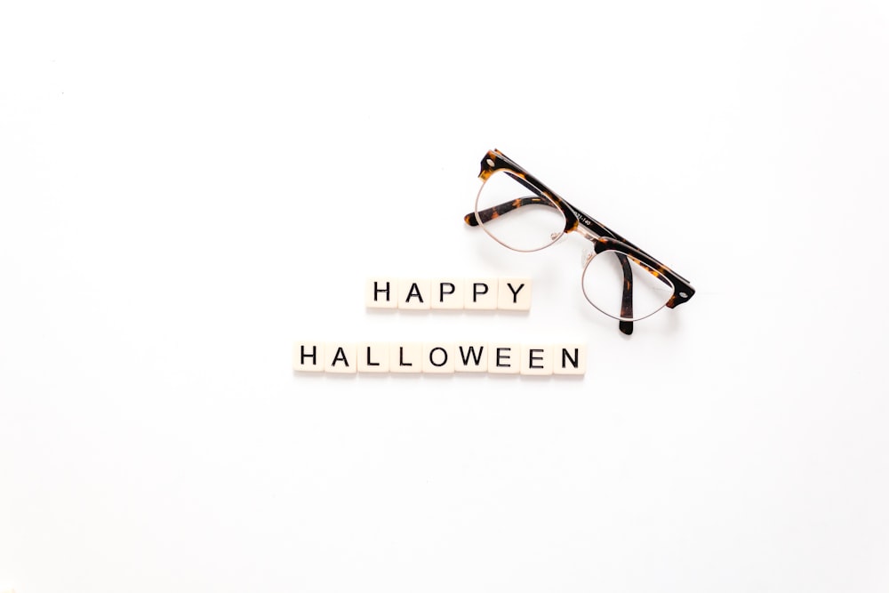 happy Halloween text on white background