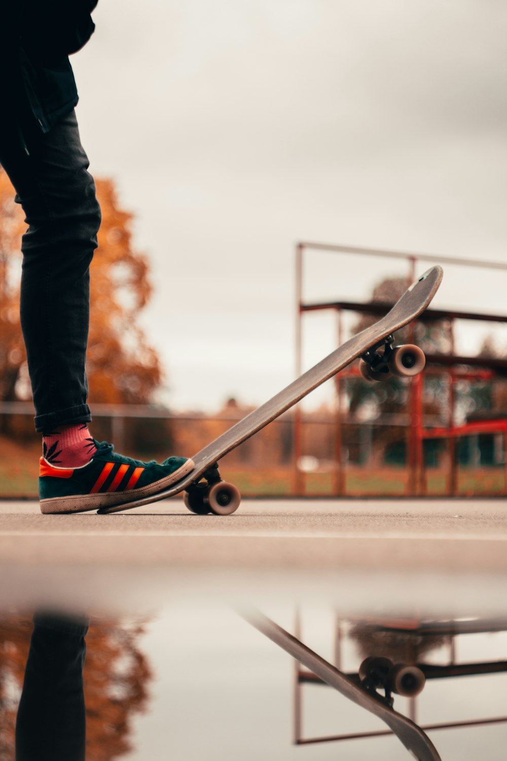 person stepping on skateboard