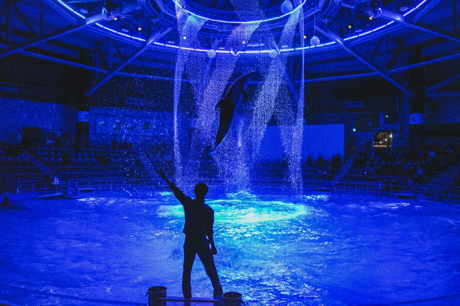 silhouette of man performing on stage