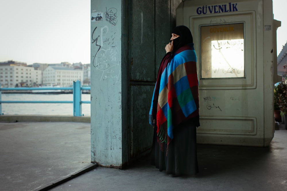 woman wearing multicolored abaya dress