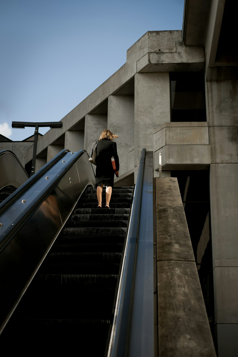 woman on escalator