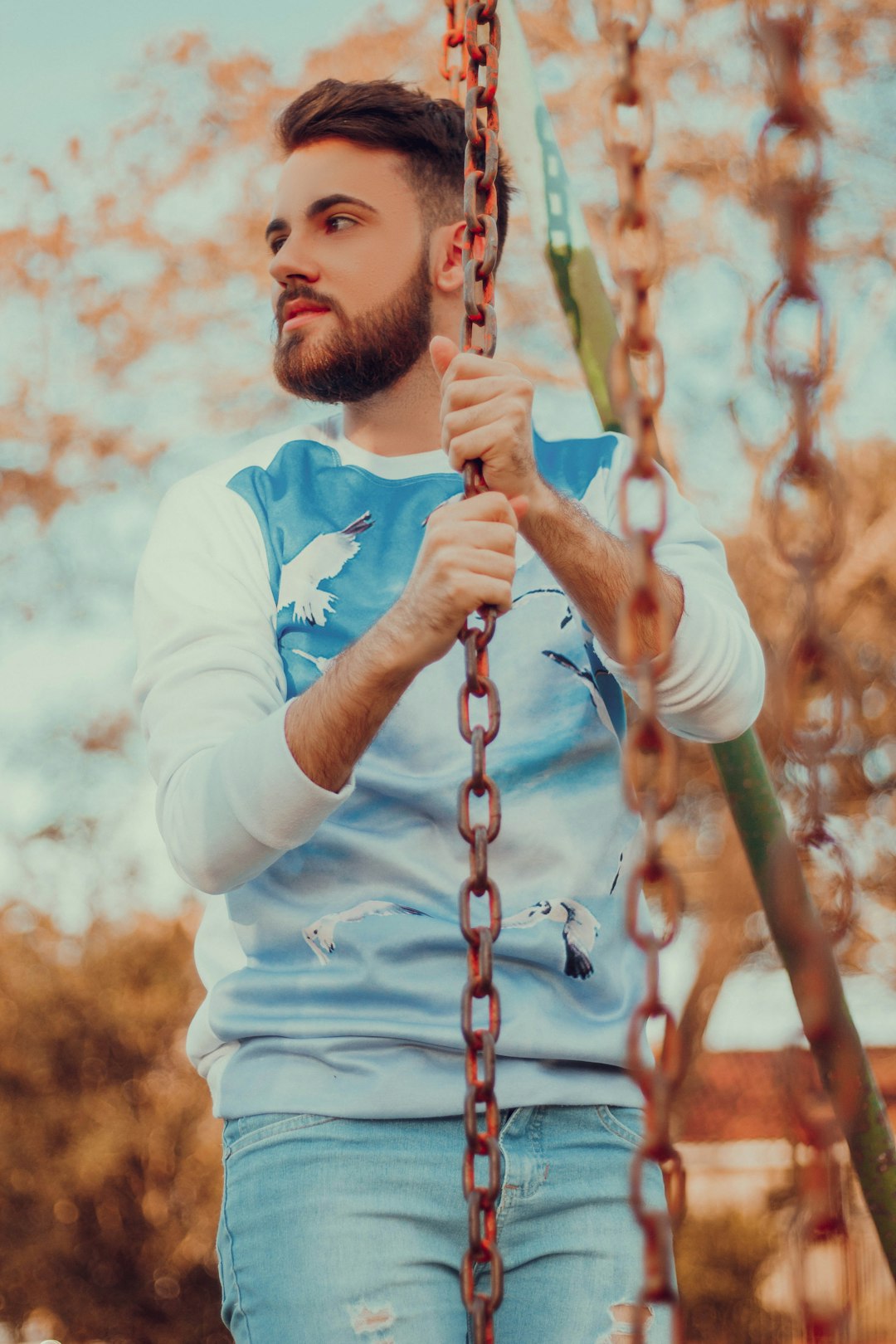 man in blue and white sweater