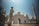 man standing near white mosque