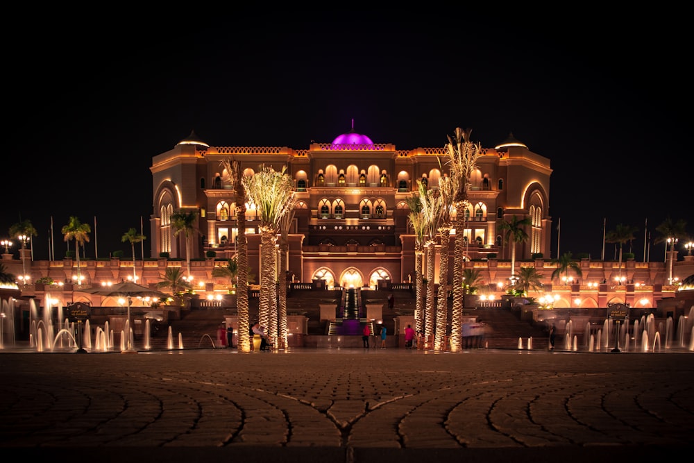 brown mansion with lights during nighttime