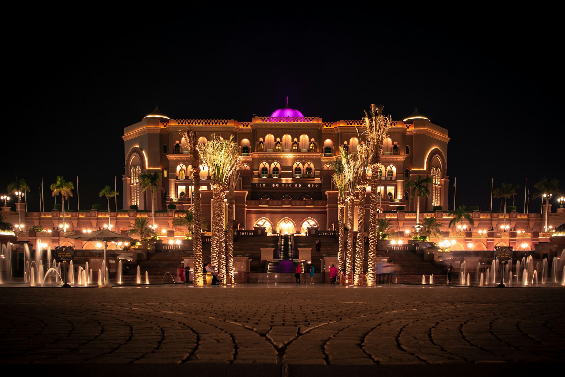 brown mansion with lights during nighttime