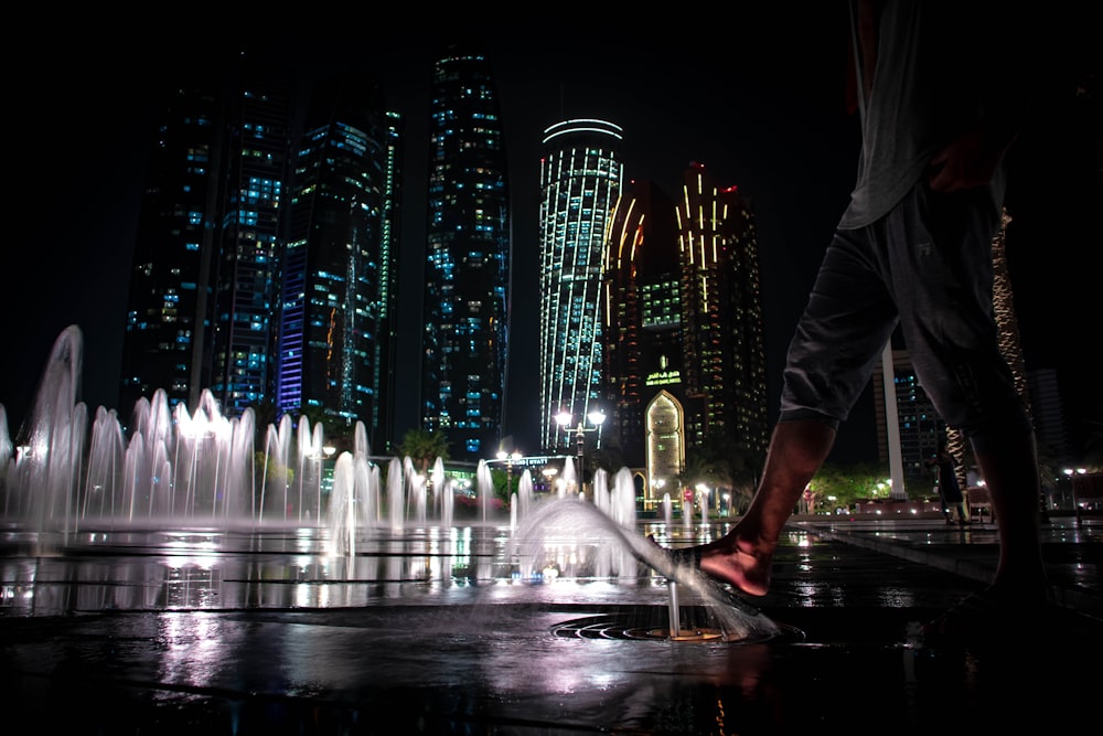 water fountain in front of building during nighttime