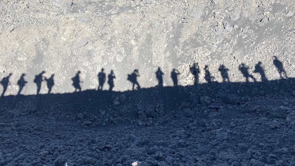 shadow of people hiking on mountain