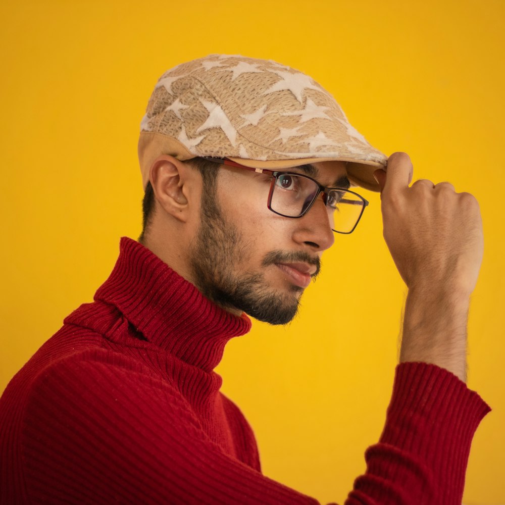 man holding his berret cap