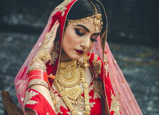 woman wearing wedding sari looking downwards