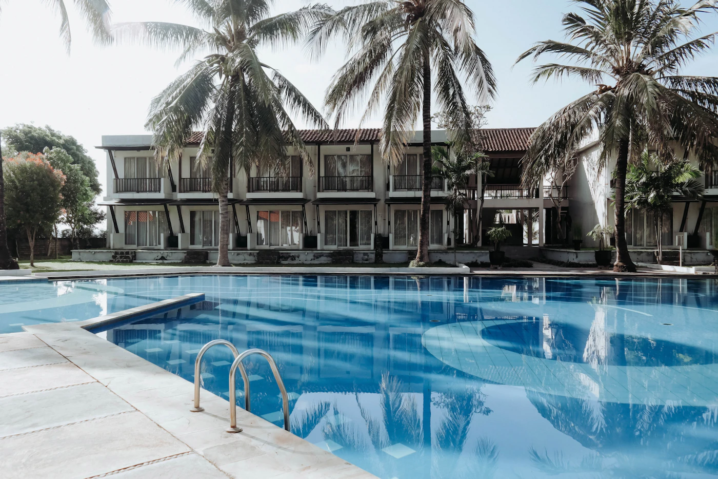 A palm-lined resort pool