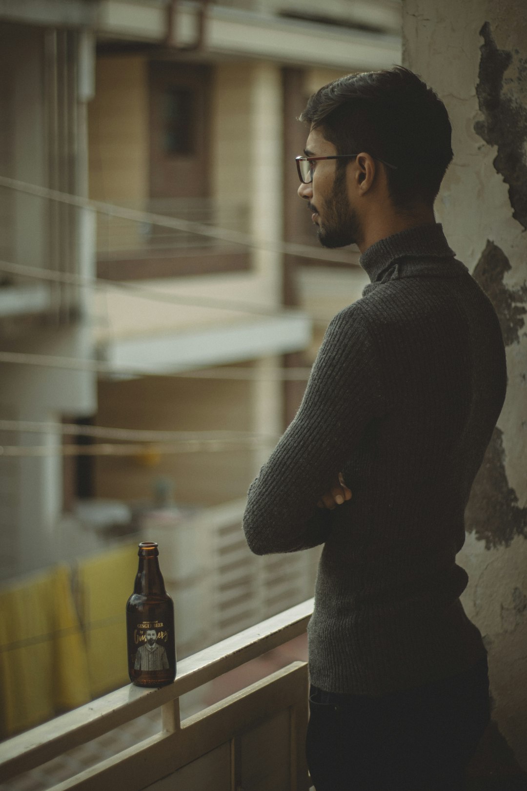 man standing by railings