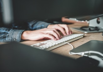 person using computer keyboard