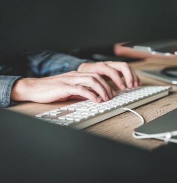 person using computer keyboard