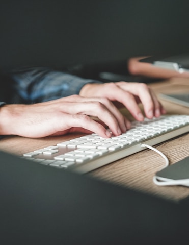 person using computer keyboard