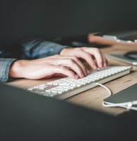 person using computer keyboard