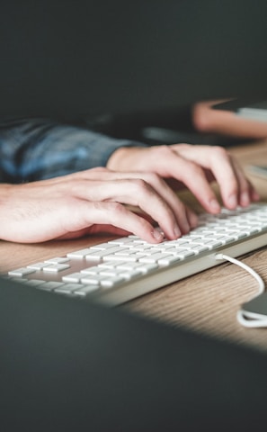 person using computer keyboard