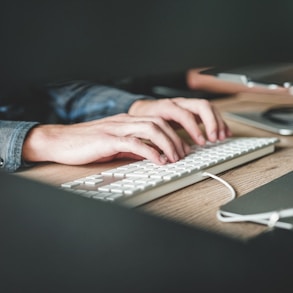 person using computer keyboard