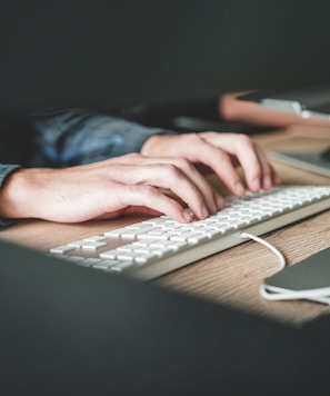 person using computer keyboard