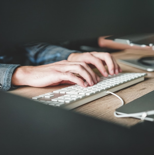 person using computer keyboard