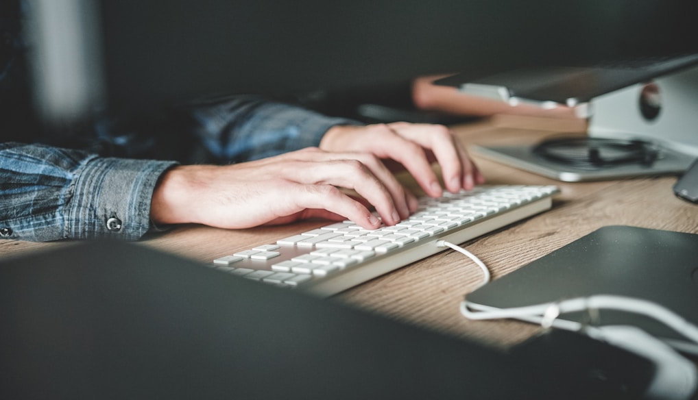 person using computer keyboard