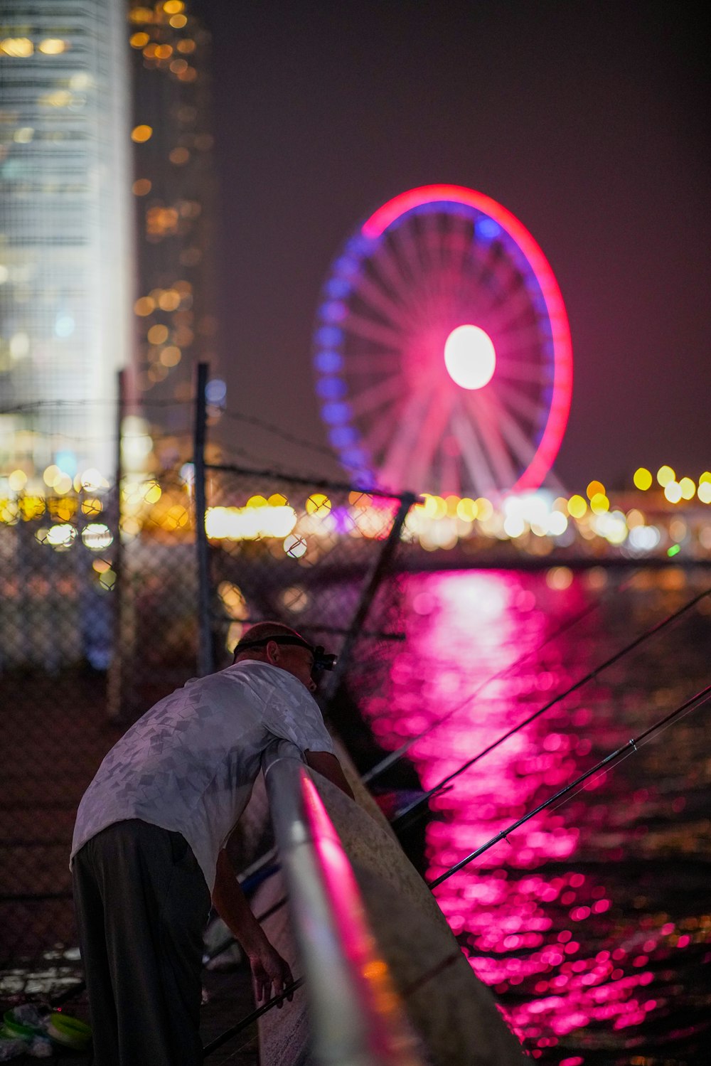 man leaning on rail on selective focus photography