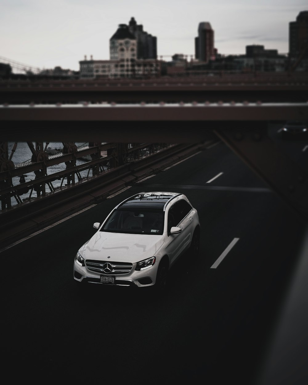 white Mercedes-Benz SUV on road