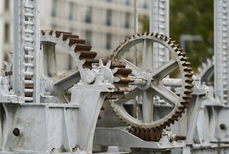 selective focus photography of machine with gears