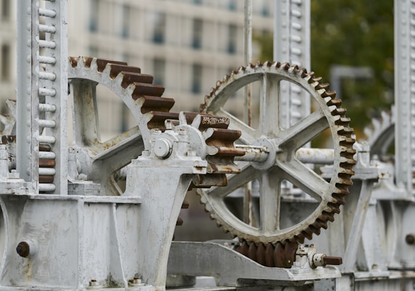 selective focus photography of machine with gears