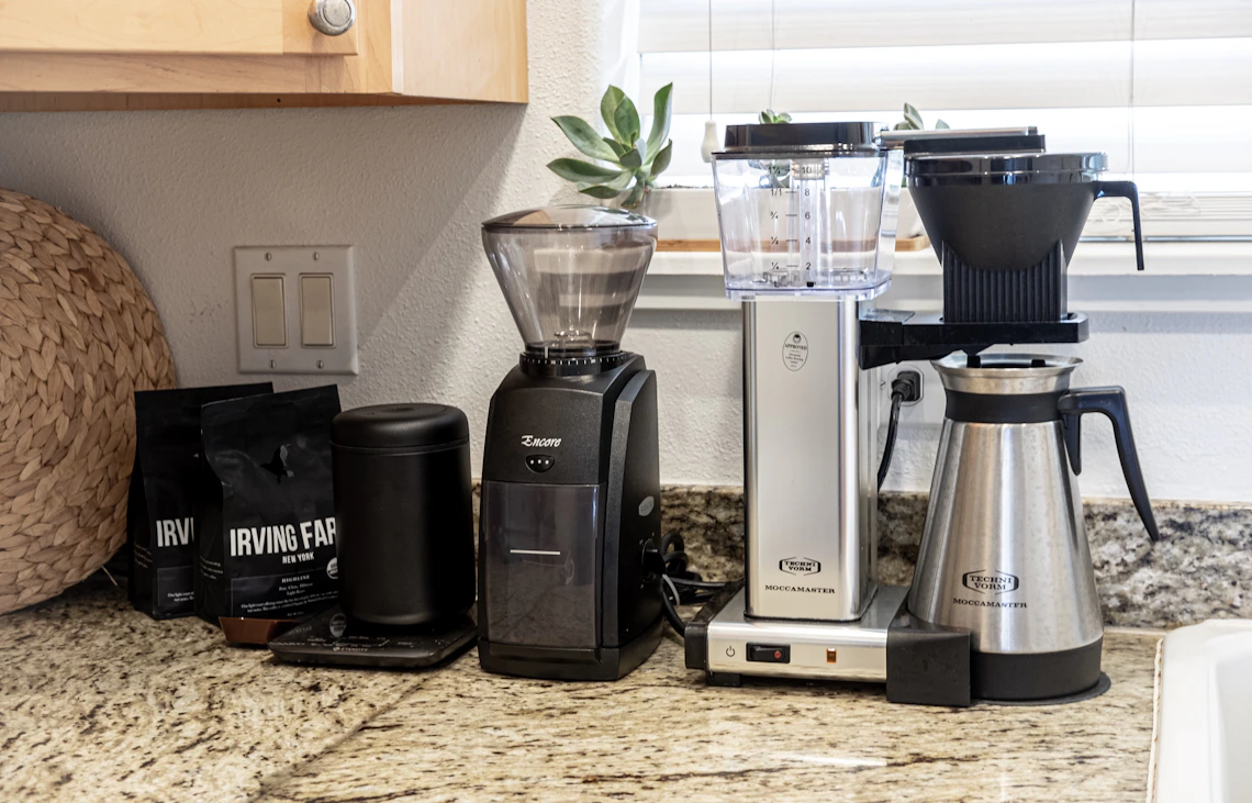 Fresh ingredients and food preparation tools arranged on a modern kitchen counter