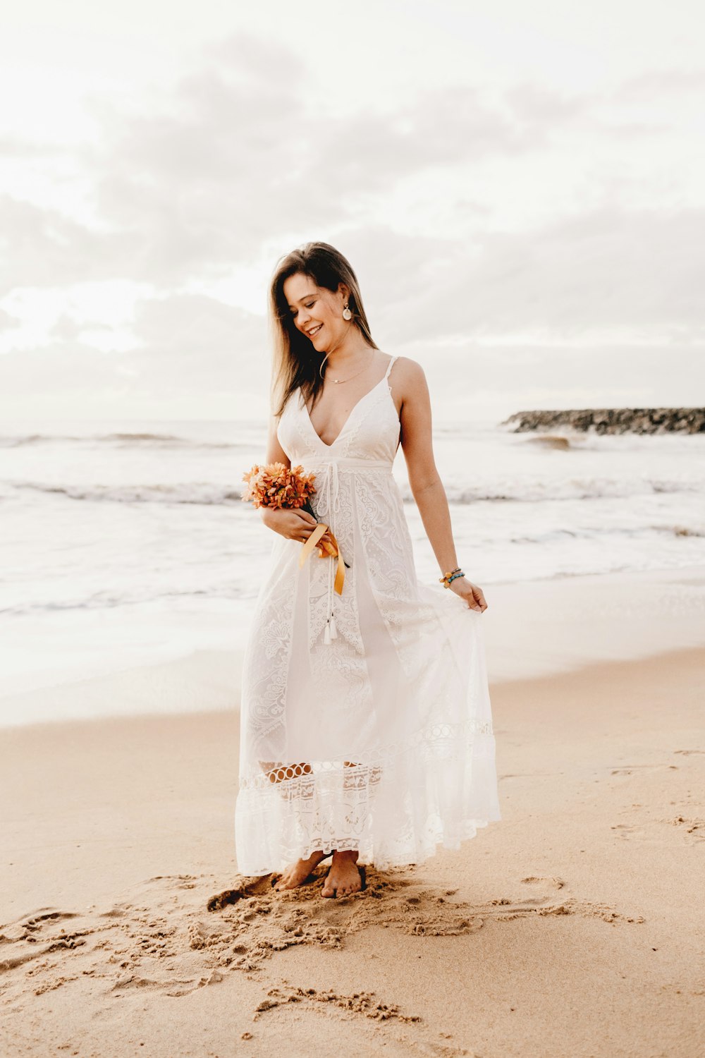 woman wears white spaghetti strap dress