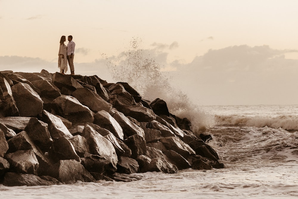 couple standing on rocks