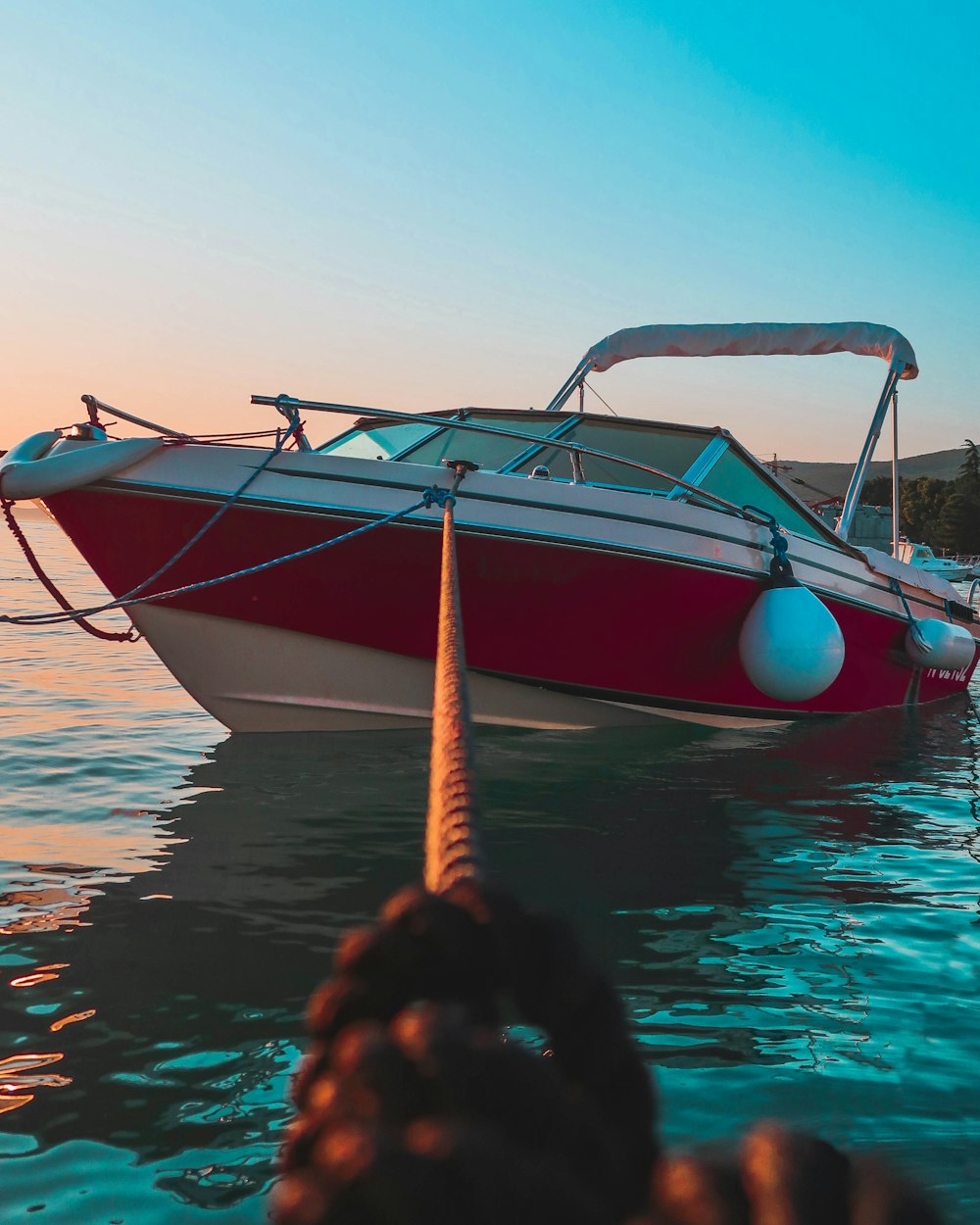 red and white motor boat