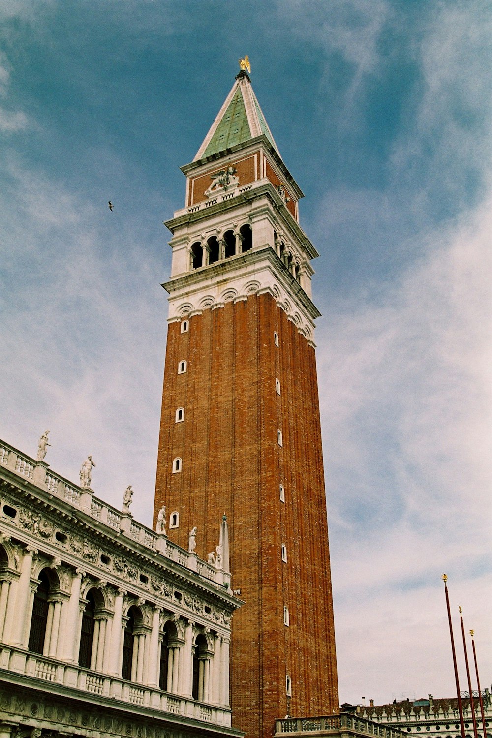 low angle photography of brown and white concrete building during daytime