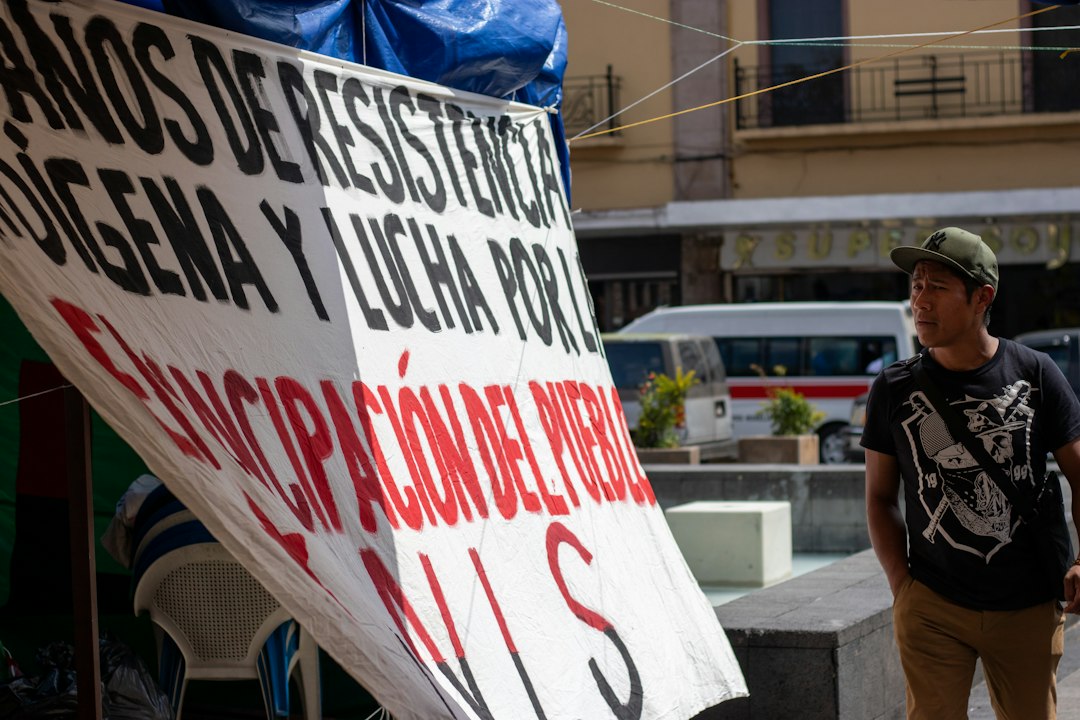 man looking at hanging sign