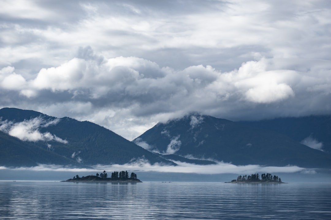 mountain beside ocean, Two lonely islands