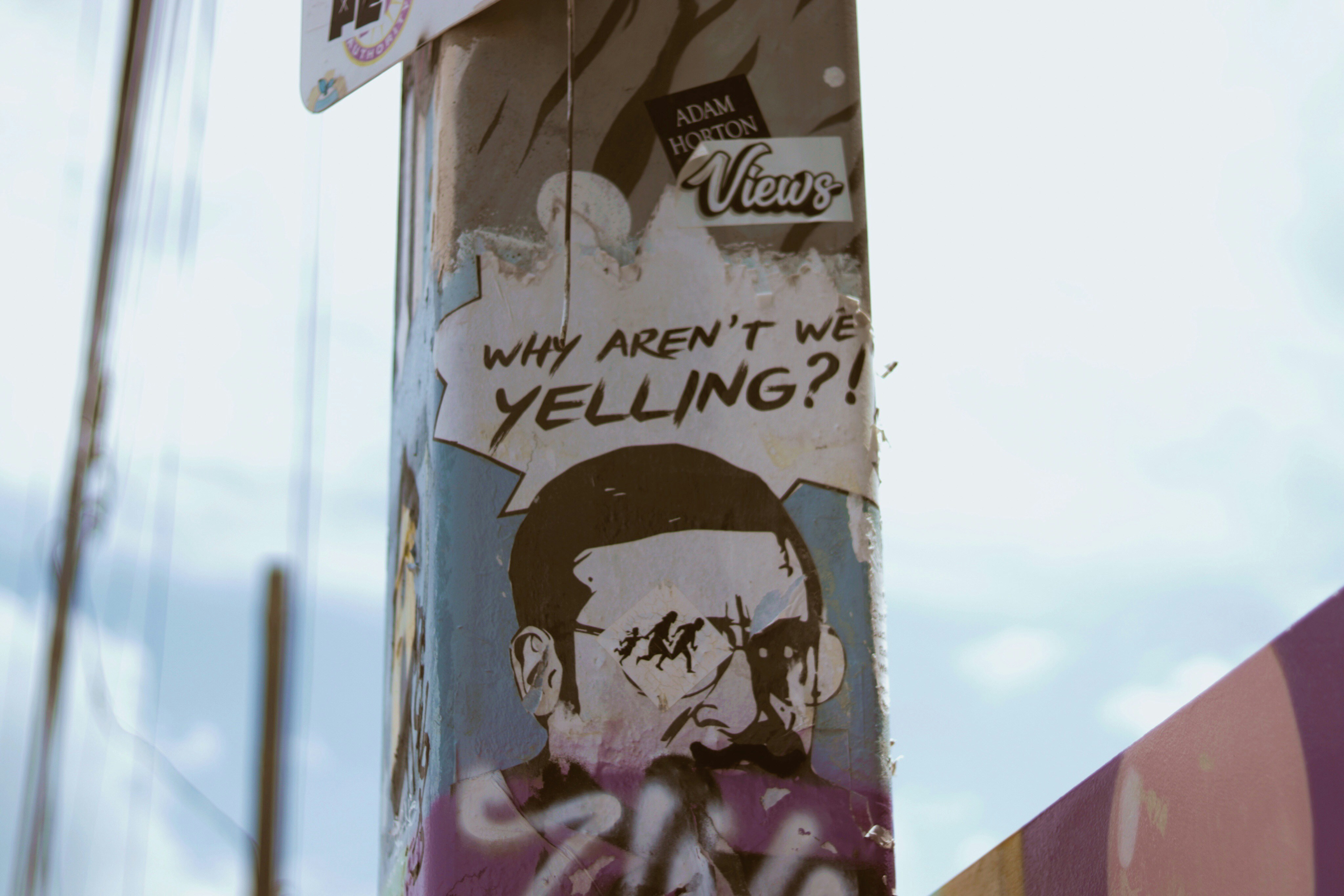 poster on post during day (Photo by Mimi Di Cianni on Unsplash)