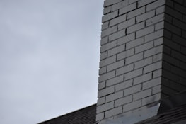 Before and after images of chimney repair.